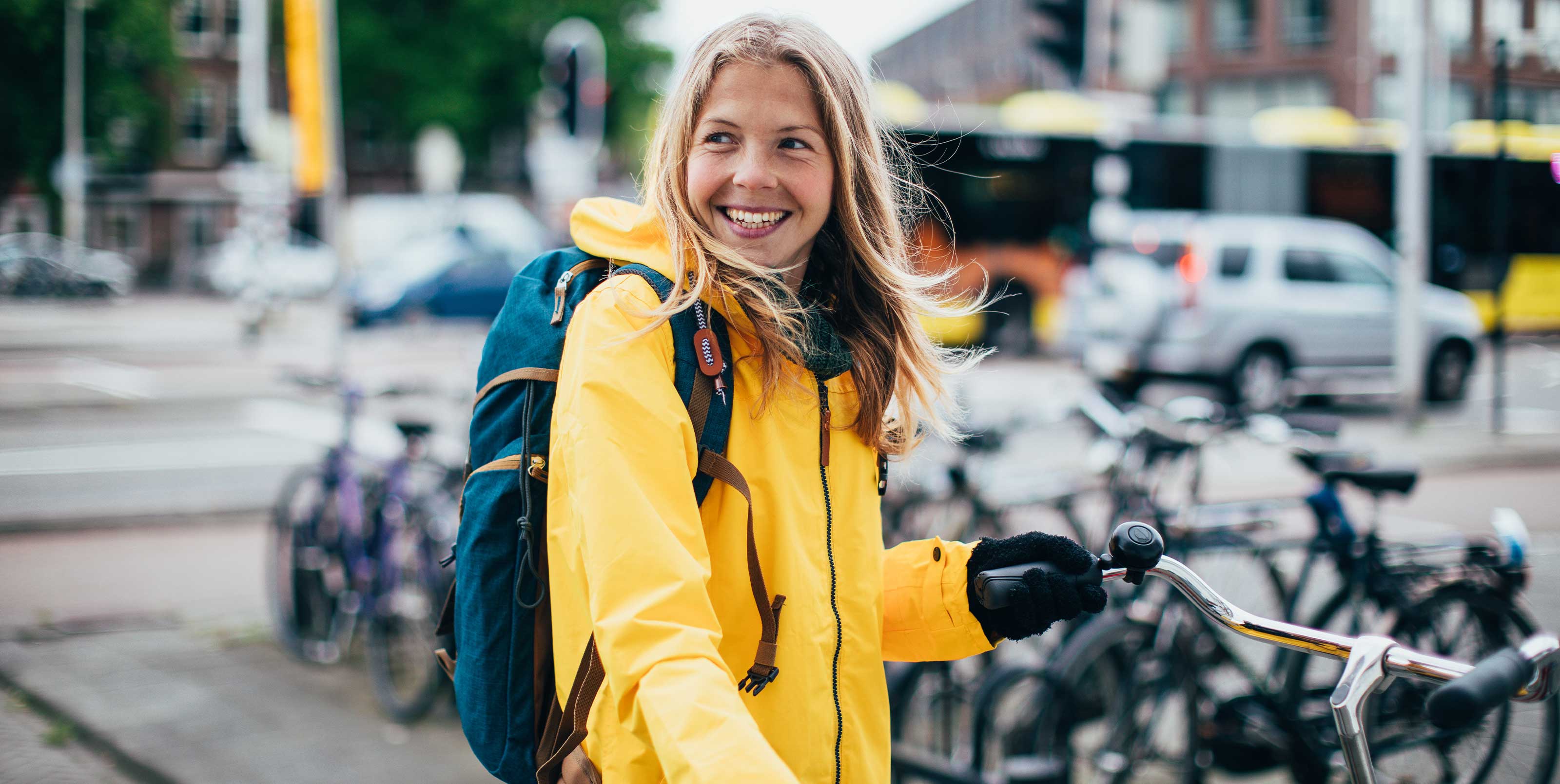 Smiling woman parking bicycle Smiling woman parking bicycle